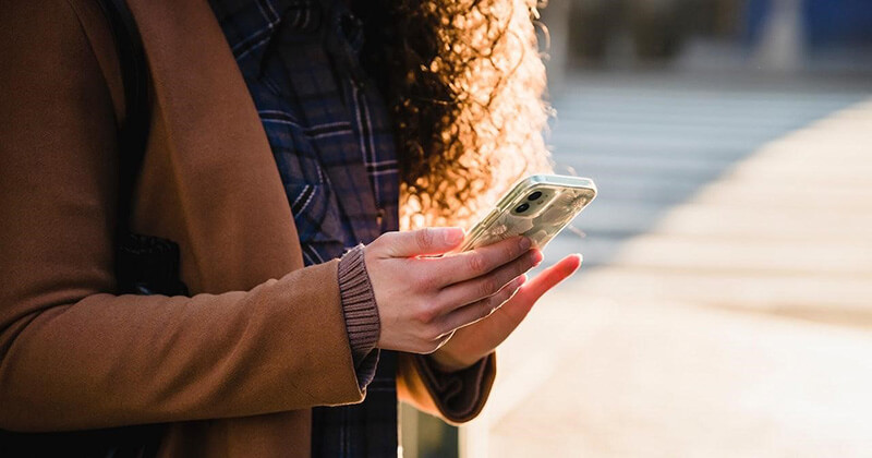 Woman browsing on smartphone.